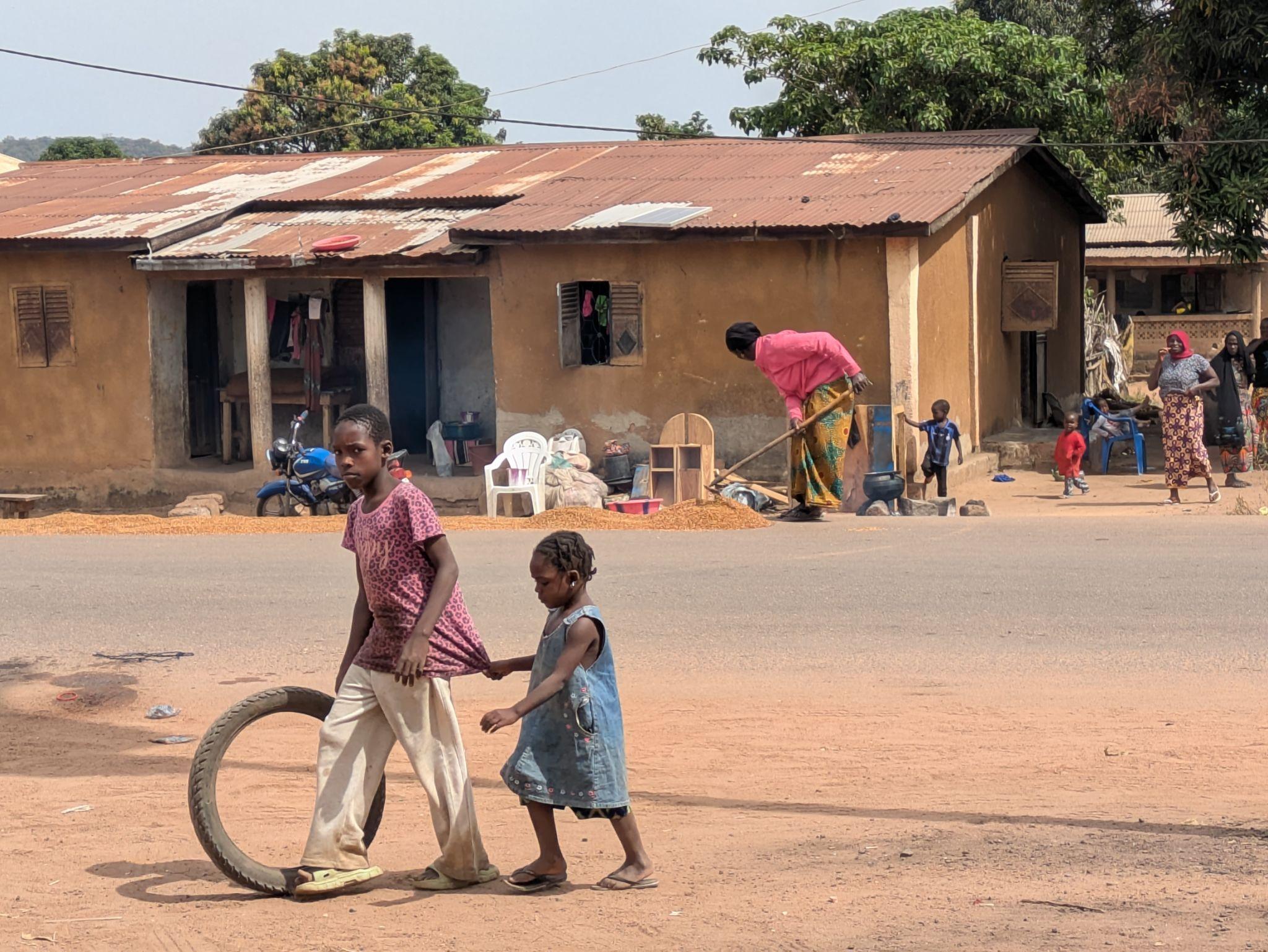 Children with tire in village