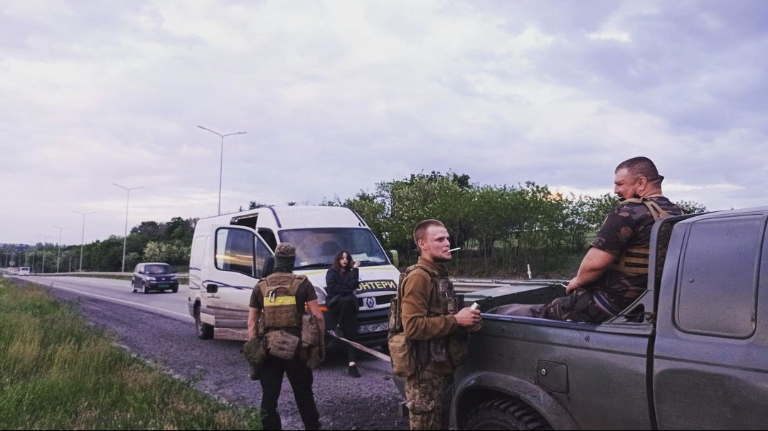 Military personnel at a road checkpoint in Donbass